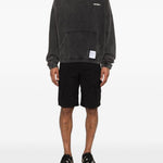 Felpa con cappuccio in nero Satisfy - unisex 