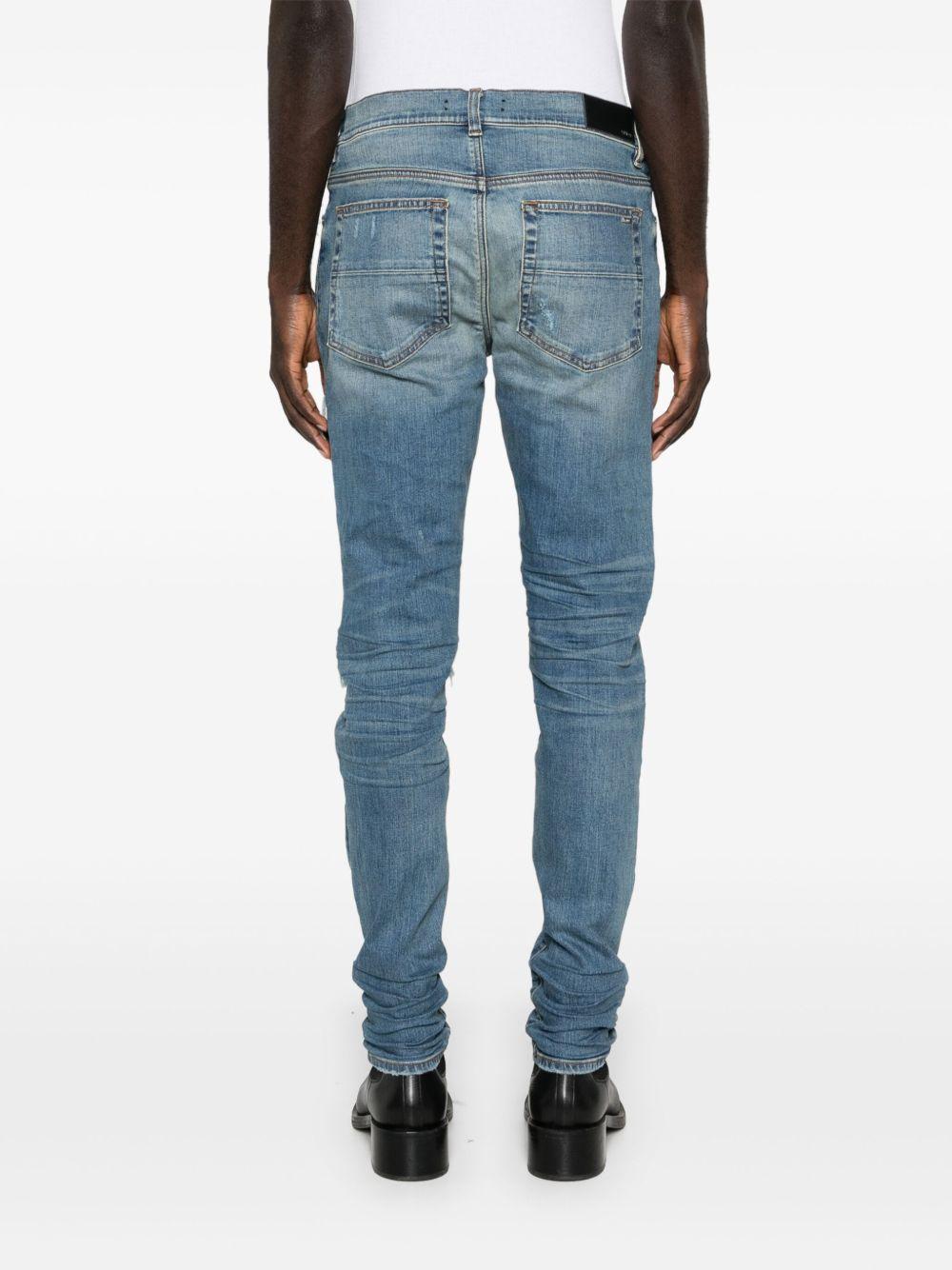 Jeans con strappi in blu 