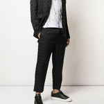 Pantaloni con trama geometrica in nero Comme des Garçons Homme Plus - uomo 