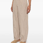 Pantaloni con vita elasticizzata in beige Gongdid design - uomo 
