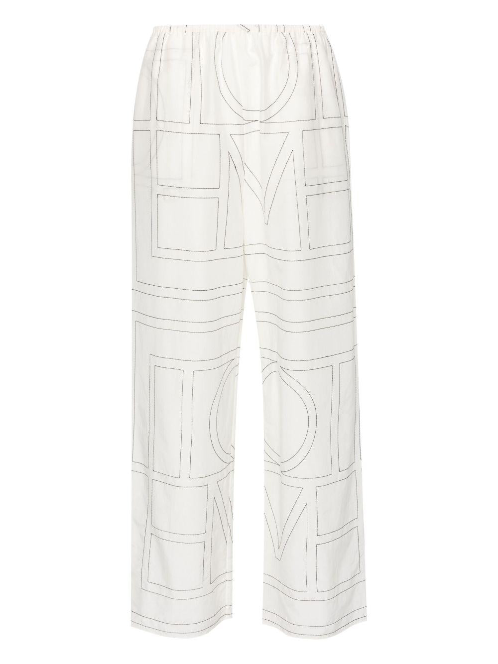 Pantaloni con monogramma ricamato in bianco Toteme - donna 