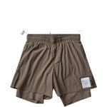 Shorts tecnici da running in beige 
