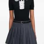 Polo con colletto in pizzo in nero 