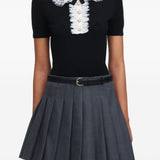 Polo con colletto in pizzo in nero 