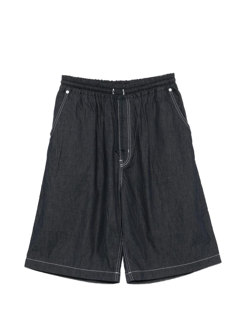 Pantaloncini con cuciture a contrasto in blu Comme des garcons homme - uomo 