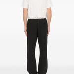 Pantaloni con applicazione in nero Mm6 maison margiela - uomo 