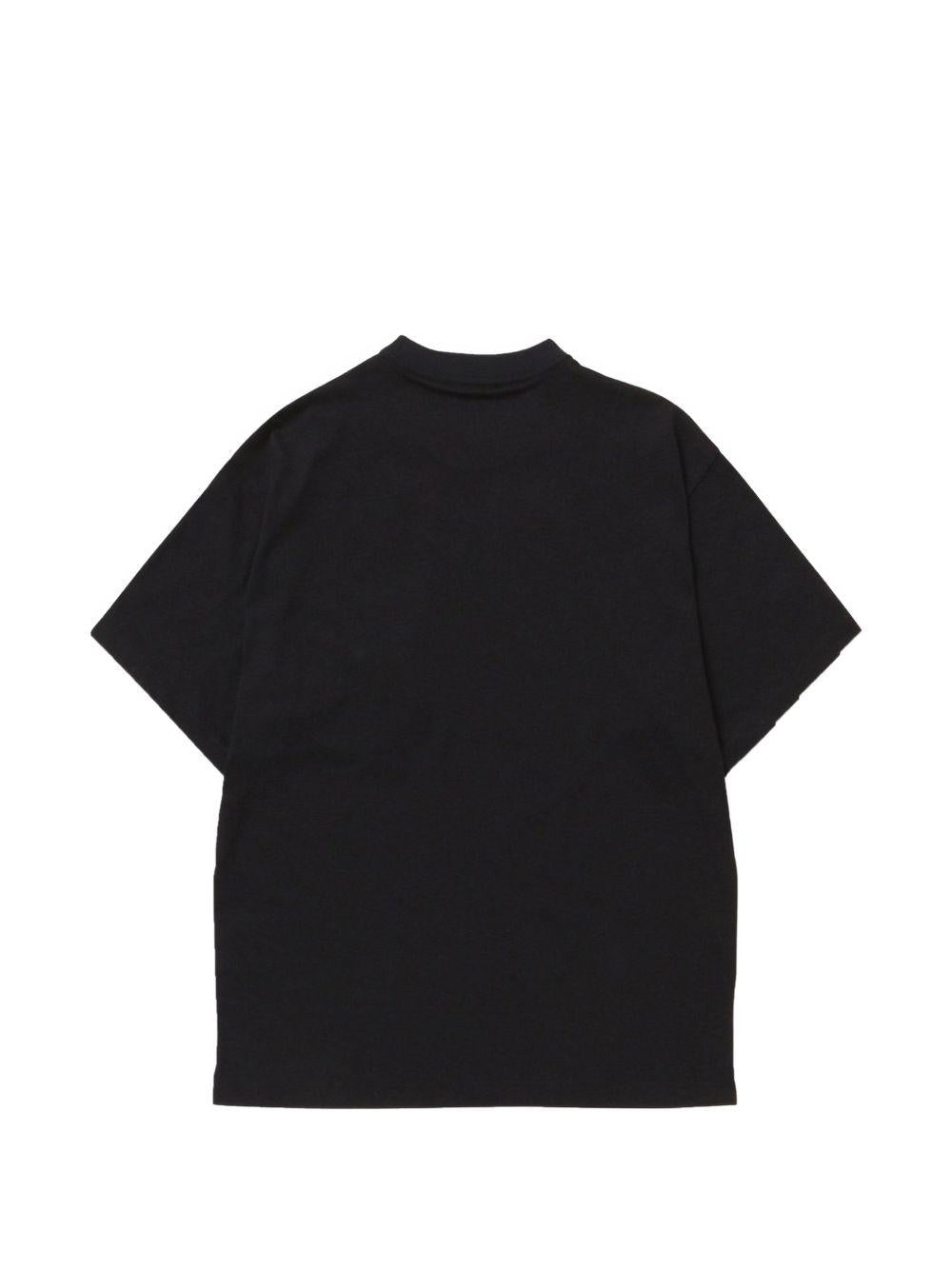 T-shirt con moschettone e tasca sul petto in nero And wander - uomo 