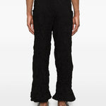 Pantaloni a gamba ampia in nero Gongdid design - uomo 