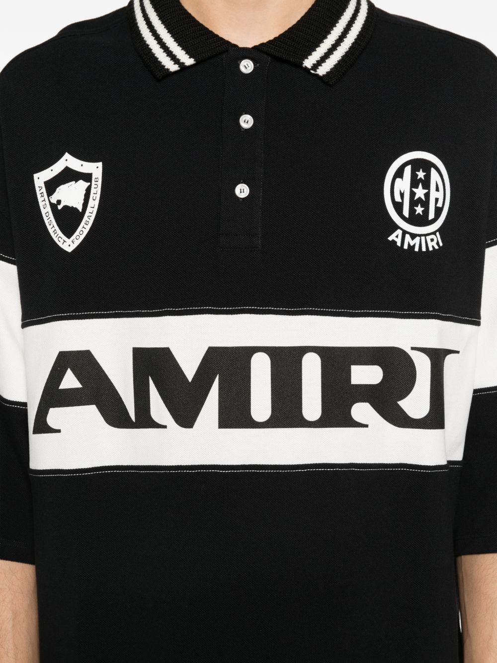 Polo con logo e dettagli a righe in nero e bianco Amiri - uomo 