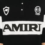 Polo con logo e dettagli a righe in nero e bianco Amiri - uomo 