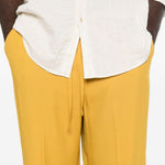 Pantaloni con coulisse in vita e piega stirata in giallo Second layer - uomo 