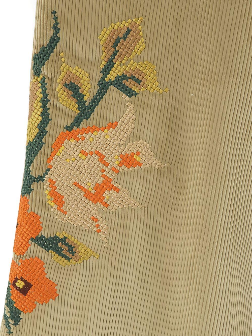 Pantaloni con ricamo floreale in beige Khoki - uomo 