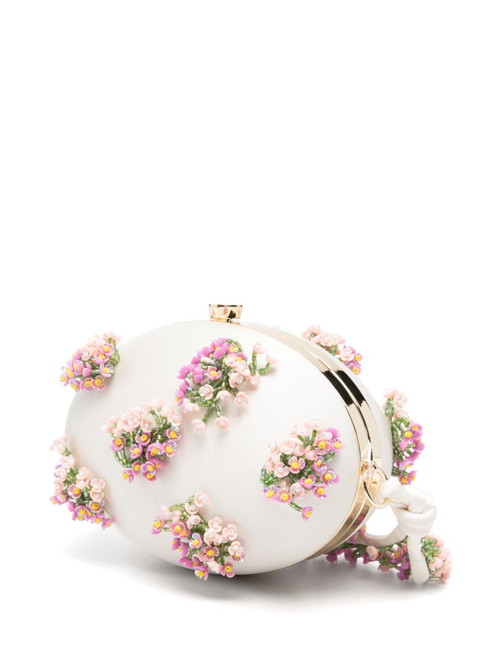 Clutch ovale con fiori in crema 
