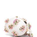 Clutch ovale con fiori in crema 