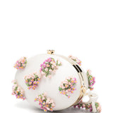Clutch ovale con fiori in crema 