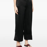 Pantaloni satinati con coulisse in nero Toteme - donna 