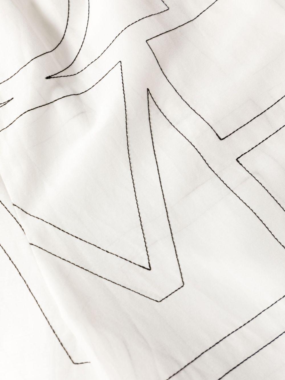Pantaloni con monogramma ricamato in bianco Toteme - donna 