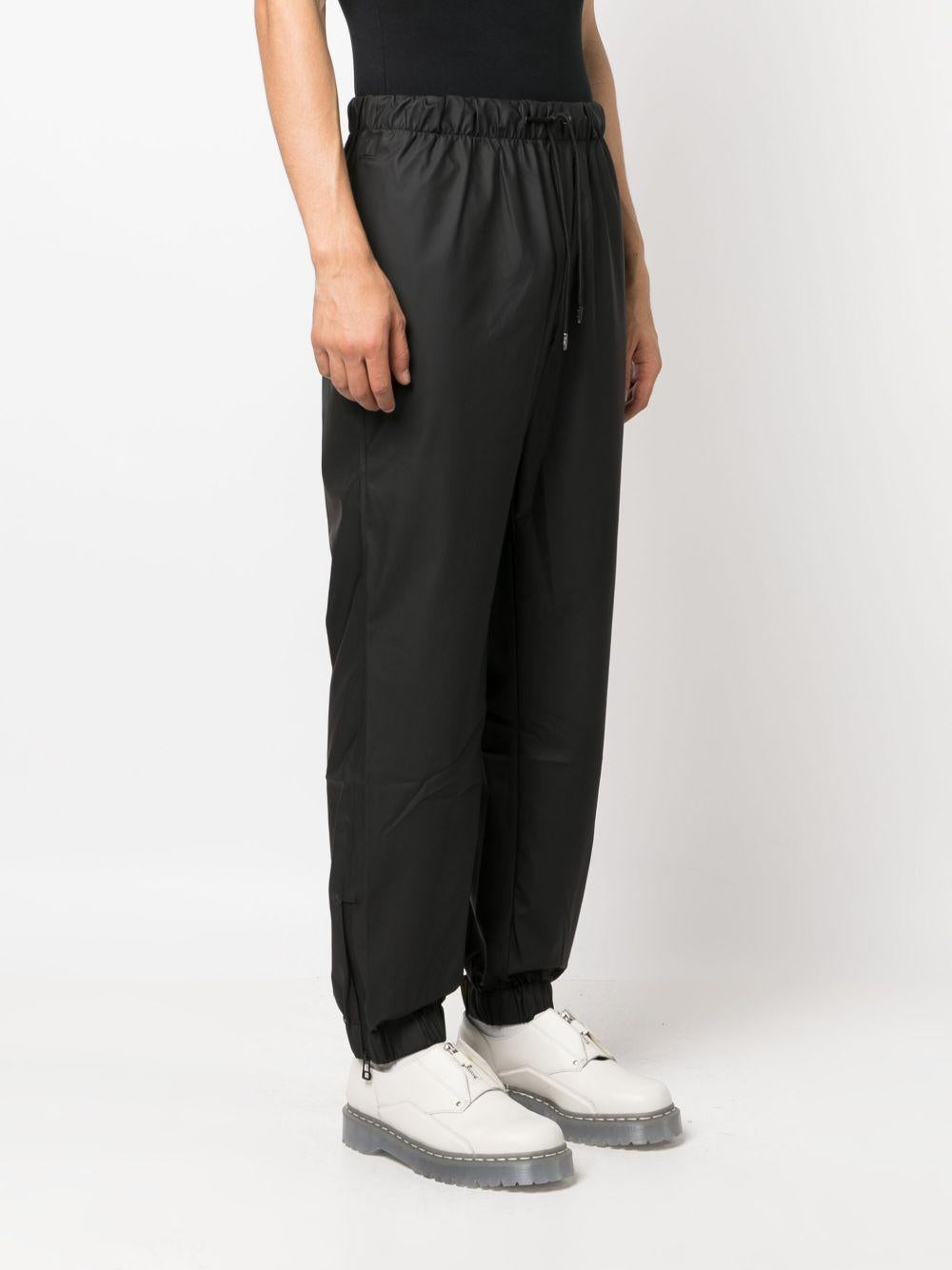 Pantaloni elasticizzati con coulisse in nero Rains - donna 