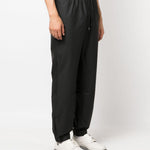 Pantaloni elasticizzati con coulisse in nero Rains - donna 