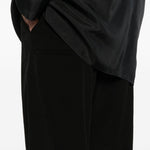 Pantaloni con bottoni in nero Yohji yamamoto - uomo 