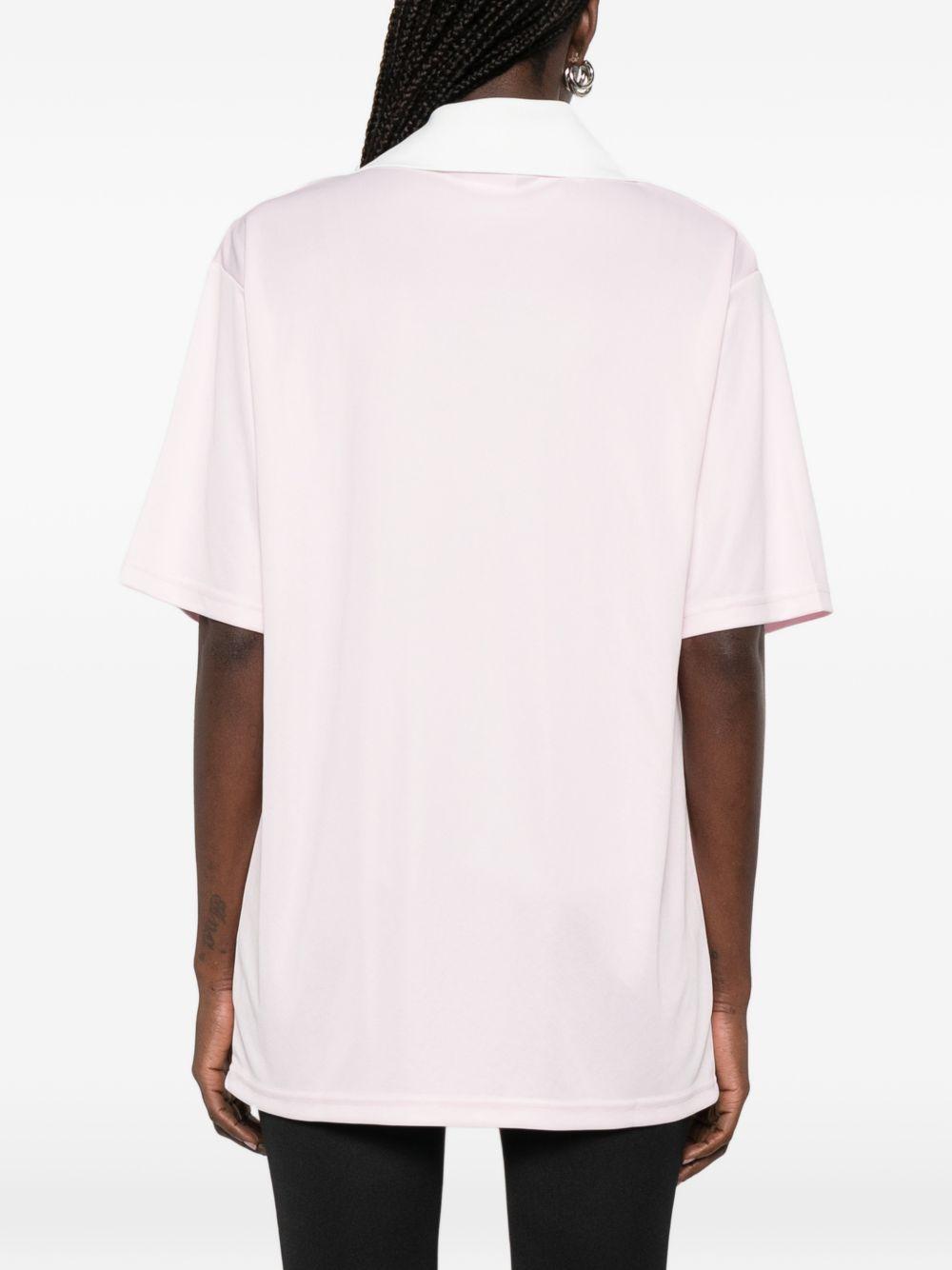 Polo con logo e ricamo a v in bianco Courrèges - donna 