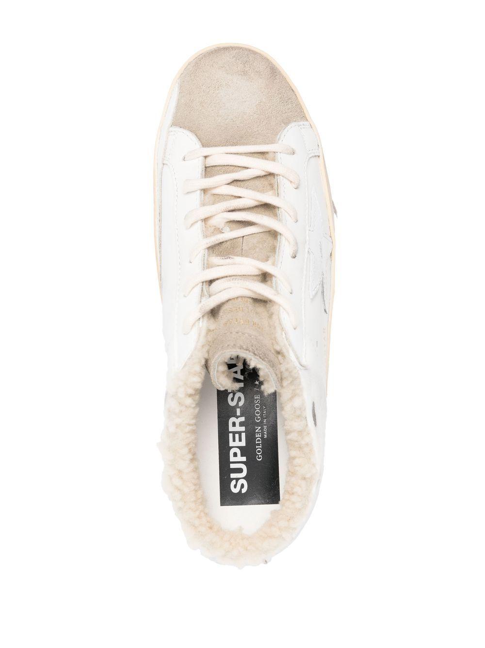 Mules Super Stat in bianco e beige 