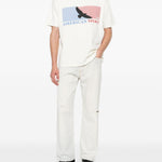 T-shirt con stampa grafica in bianco Rhude  - uomo 