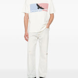 T-shirt con stampa grafica in bianco Rhude  - uomo 