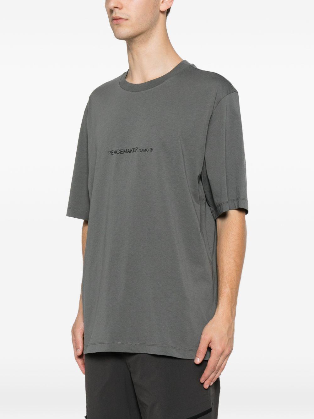 T-shirt con stampa grafica "Peacemaker" in grigio Oamc peacemaker - uomo 