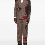 Pantaloni a righe con design patchwork  in marrone Kidsuper - uomo 