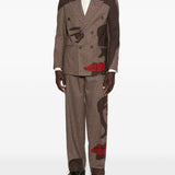 Pantaloni a righe con design patchwork  in marrone Kidsuper - uomo 