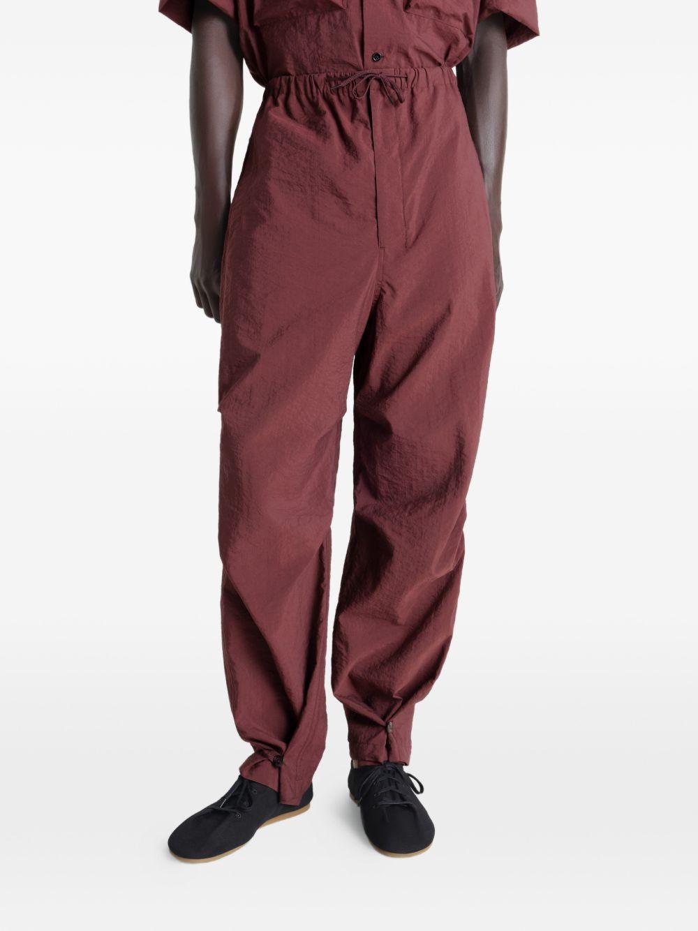 Pantaloni con pieghe in rosso Lemaire - uomo 