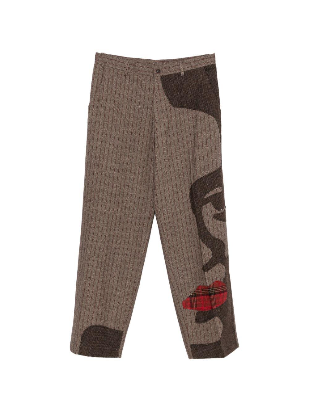 Pantaloni a righe con design patchwork  in marrone Kidsuper - uomo 