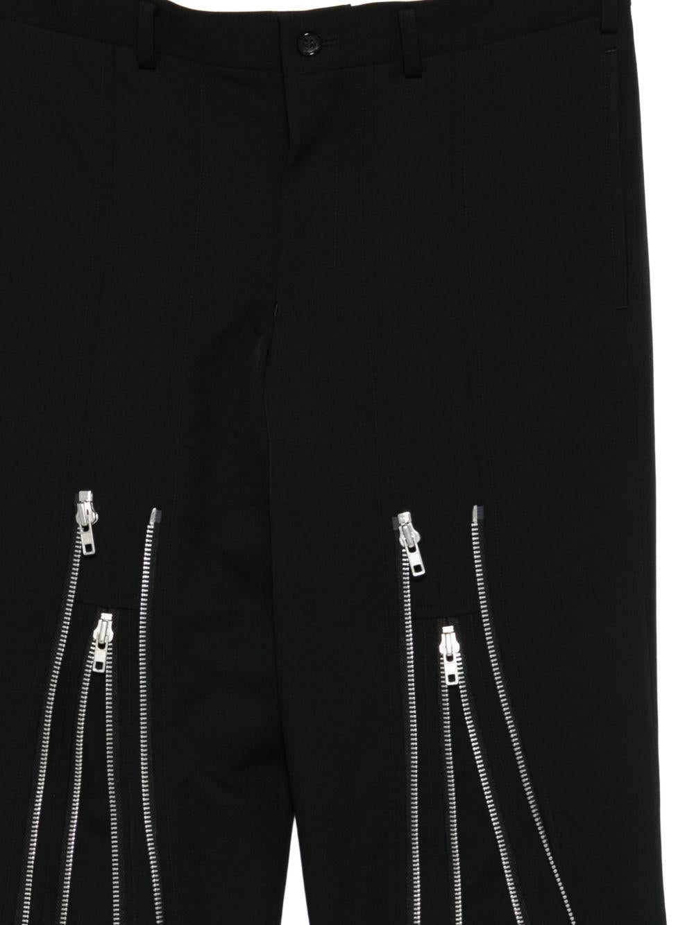 Pantaloni con zip in nero Comme des Garçons Homme Plus - uomo 