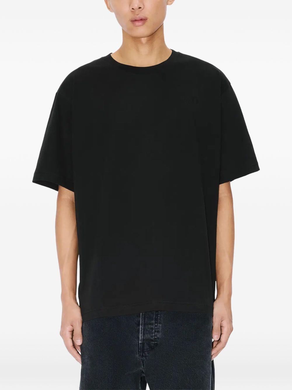 T-shirt con applicazioni di fiori in nero Kenzo - uomo 