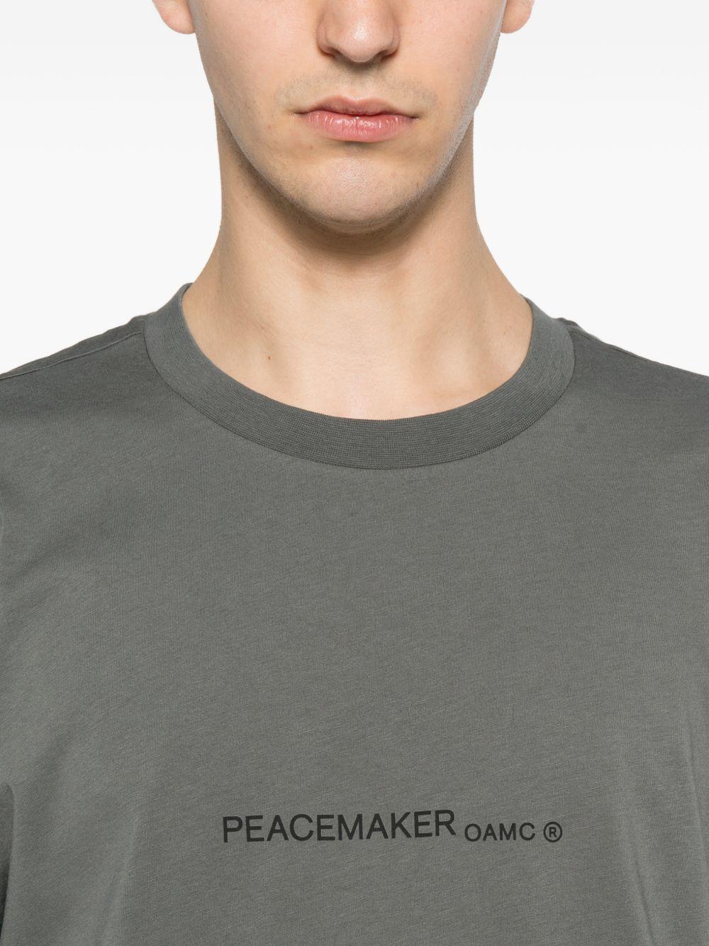 T-shirt con stampa grafica "Peacemaker" in grigio Oamc peacemaker - uomo 