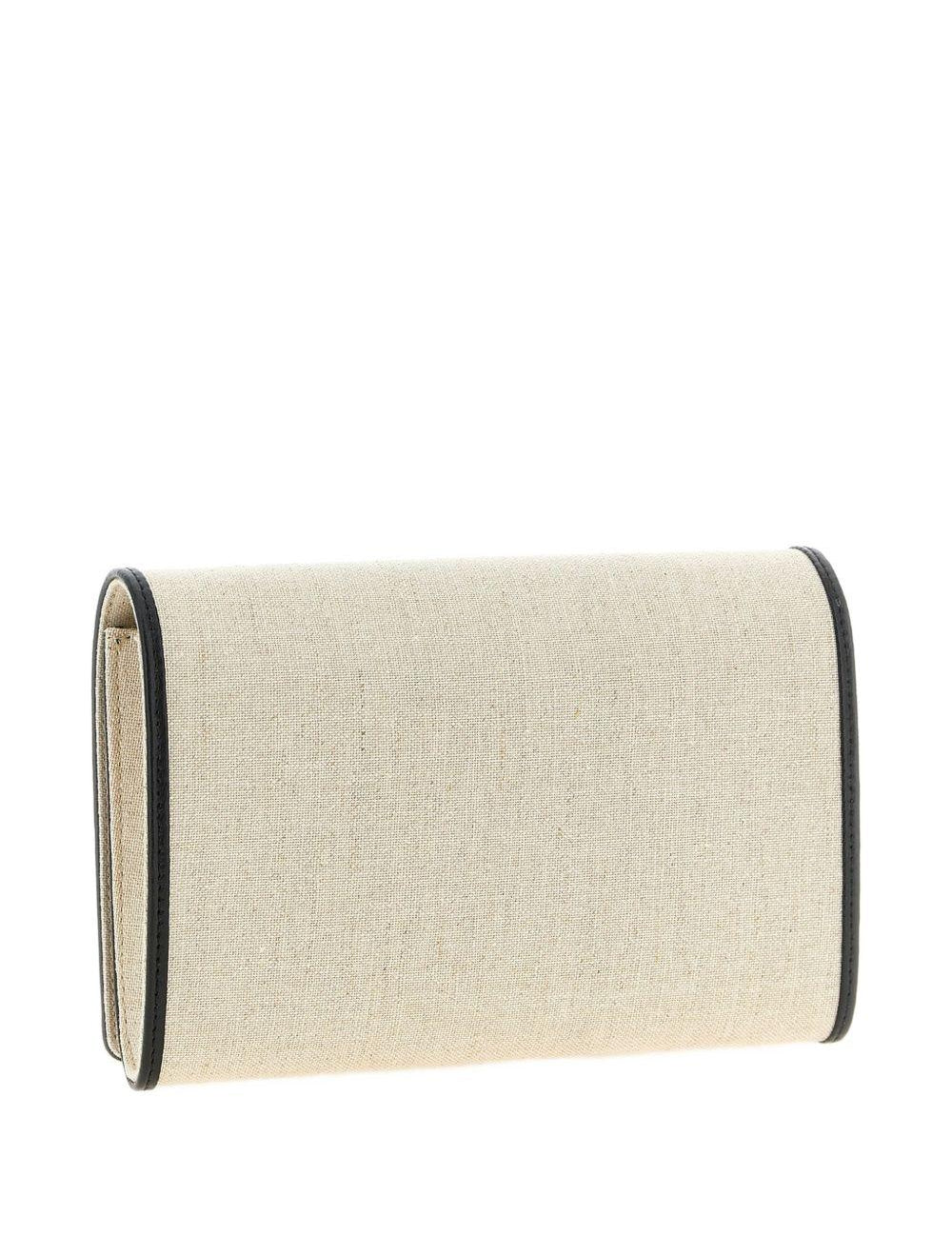 Clutch in tela con falda a T in beige 