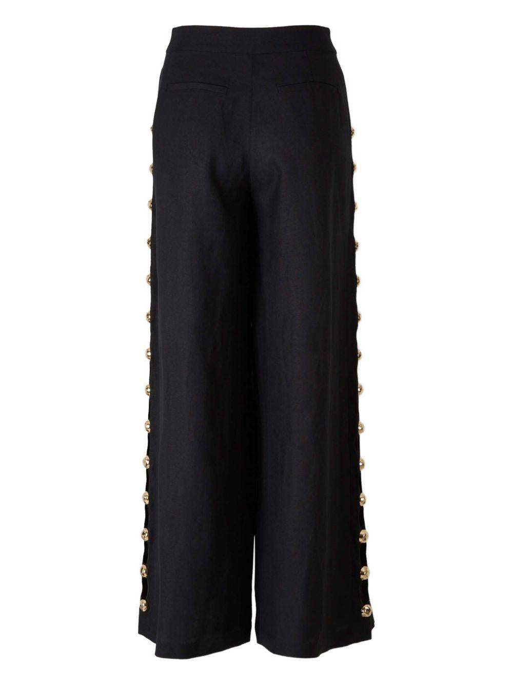 Pantaloni a palazzo Cayman con borchie in nero Simkhai - donna 