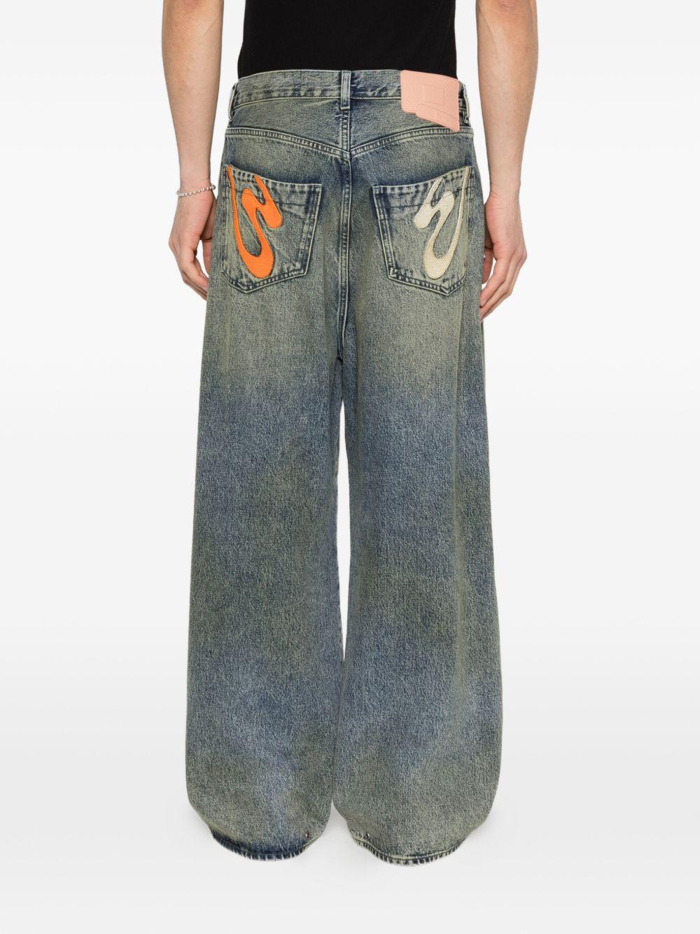 Jeans con pieghe in blu Pdf - uomo 