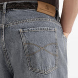 Jeans a cinque tasche in denim grigio con vestibilità iconica. In grigio Brunello cucinelli - uomo 
