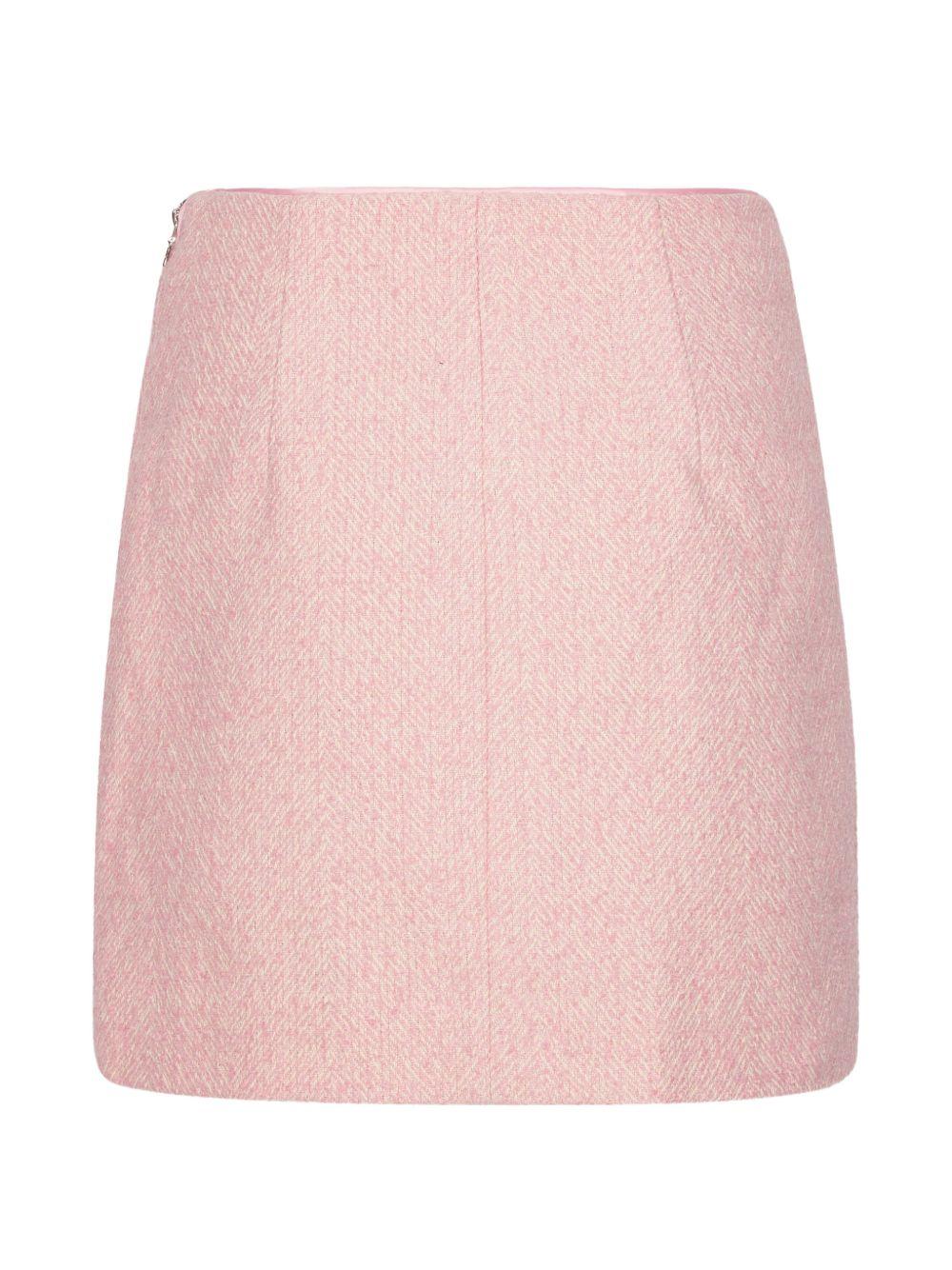 Gonna mini boucle in rosa 