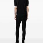 Jeans MX1 con strappi in nero 