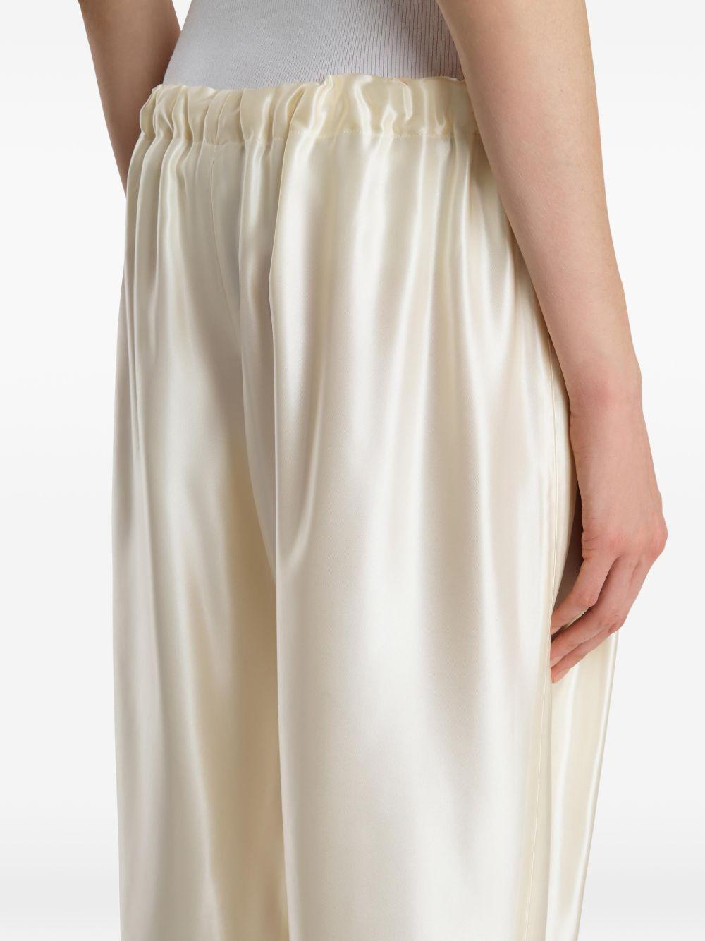 Pantaloni Rohen satinati in avorio Khaite - donna 