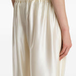 Pantaloni Rohen satinati in avorio Khaite - donna 
