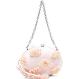 Clutch in raso rosa con decorazioni floreali 