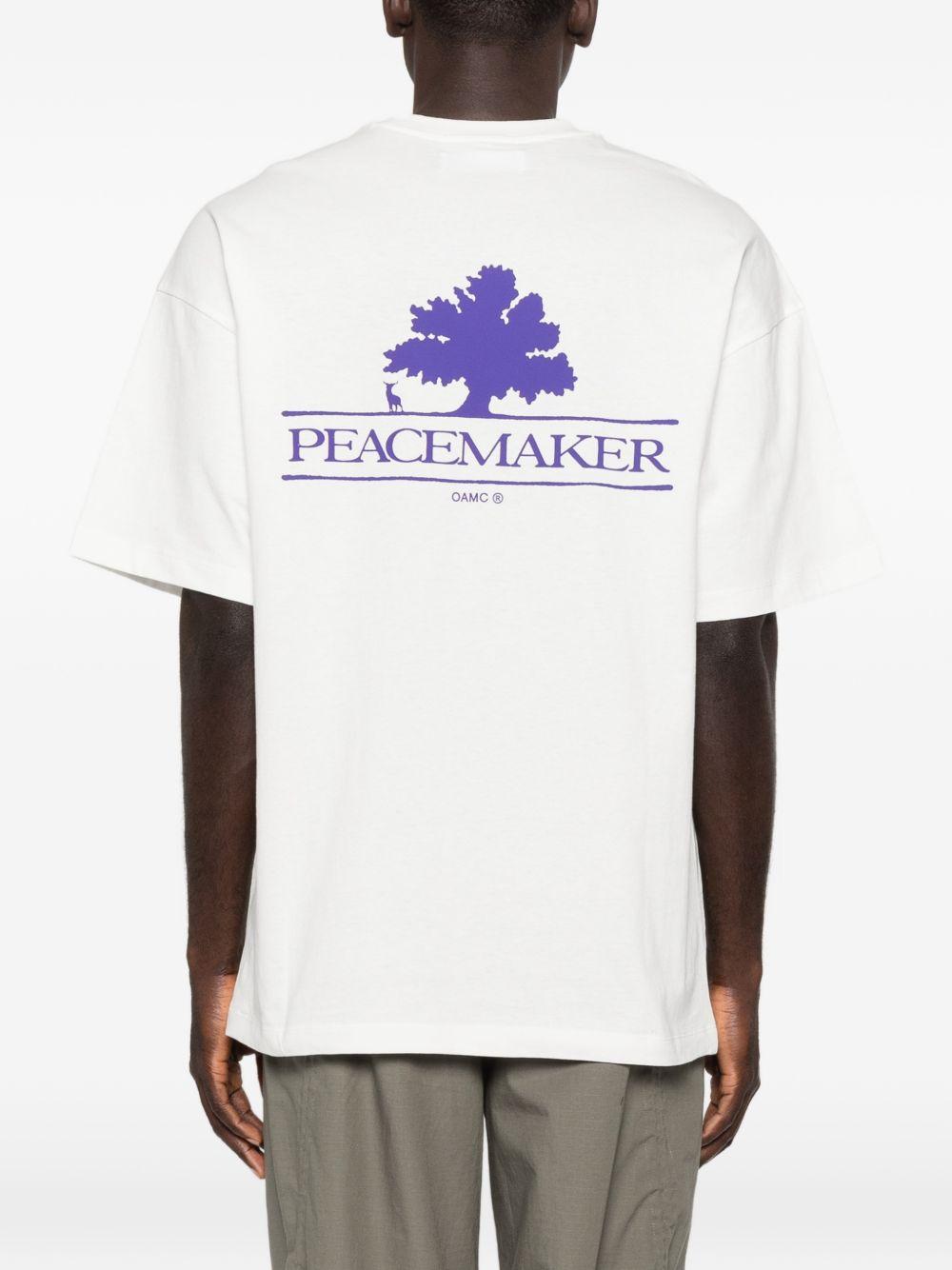 T-shirt con stampa del logo in bianco Oamc peacemaker - uomo 