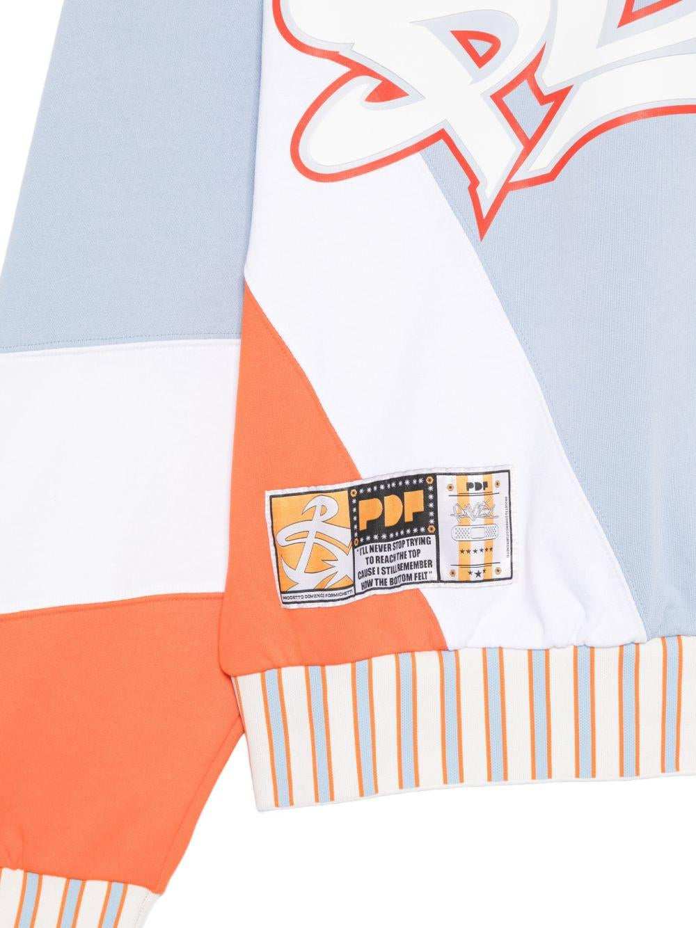 Felpa color block con stampa grafica in arancione e blu Pdf - uomo 
