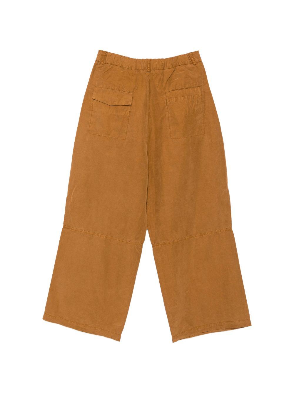 Pantaloni a gamba larga con pieghe in arancione Ymc - uomo 