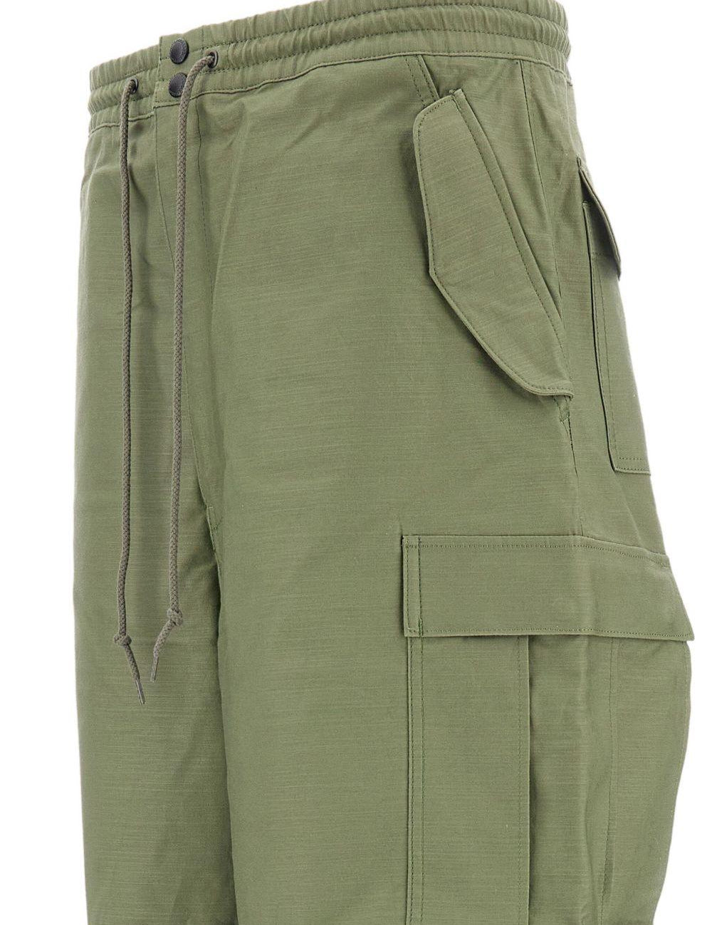 Pantaloni con tasche cargo in verde Junya watanabe - uomo 