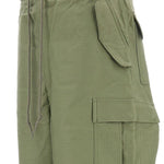 Pantaloni con tasche cargo in verde Junya watanabe - uomo 